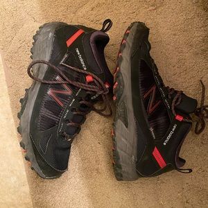 Black and red new balance hiking shoes size 8.